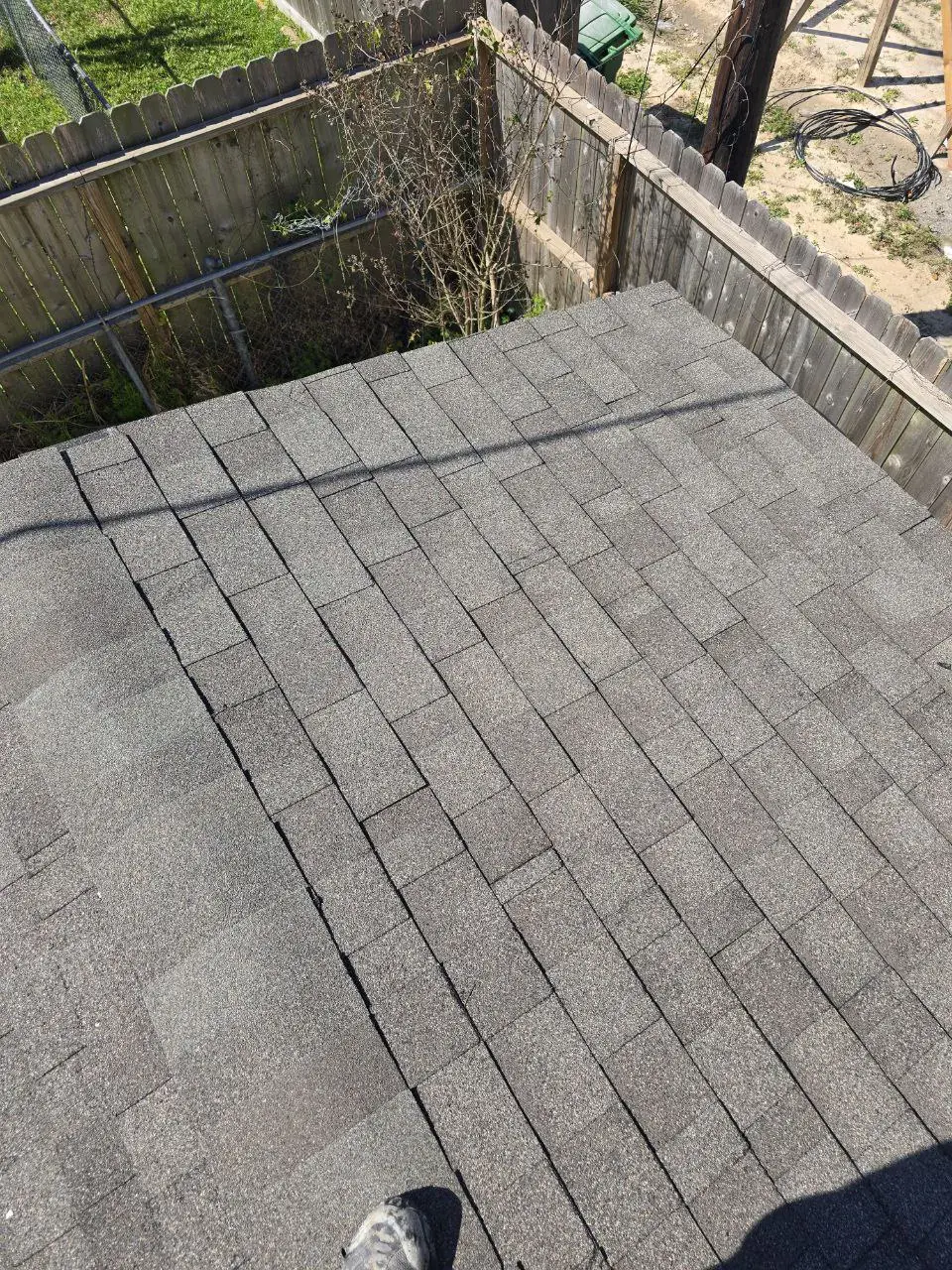30-year architectural shingles installation Houston - Weatherwood color roofing shingles closeup